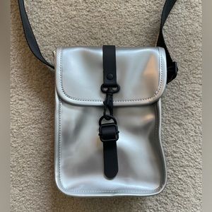 RAINS metallic flight bag travel silver waterproof crossbody